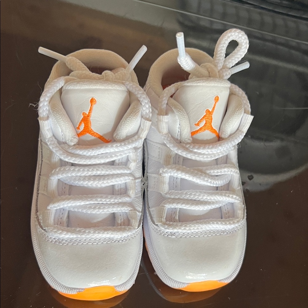 Jordan’s Kids White and Orange Sneakers